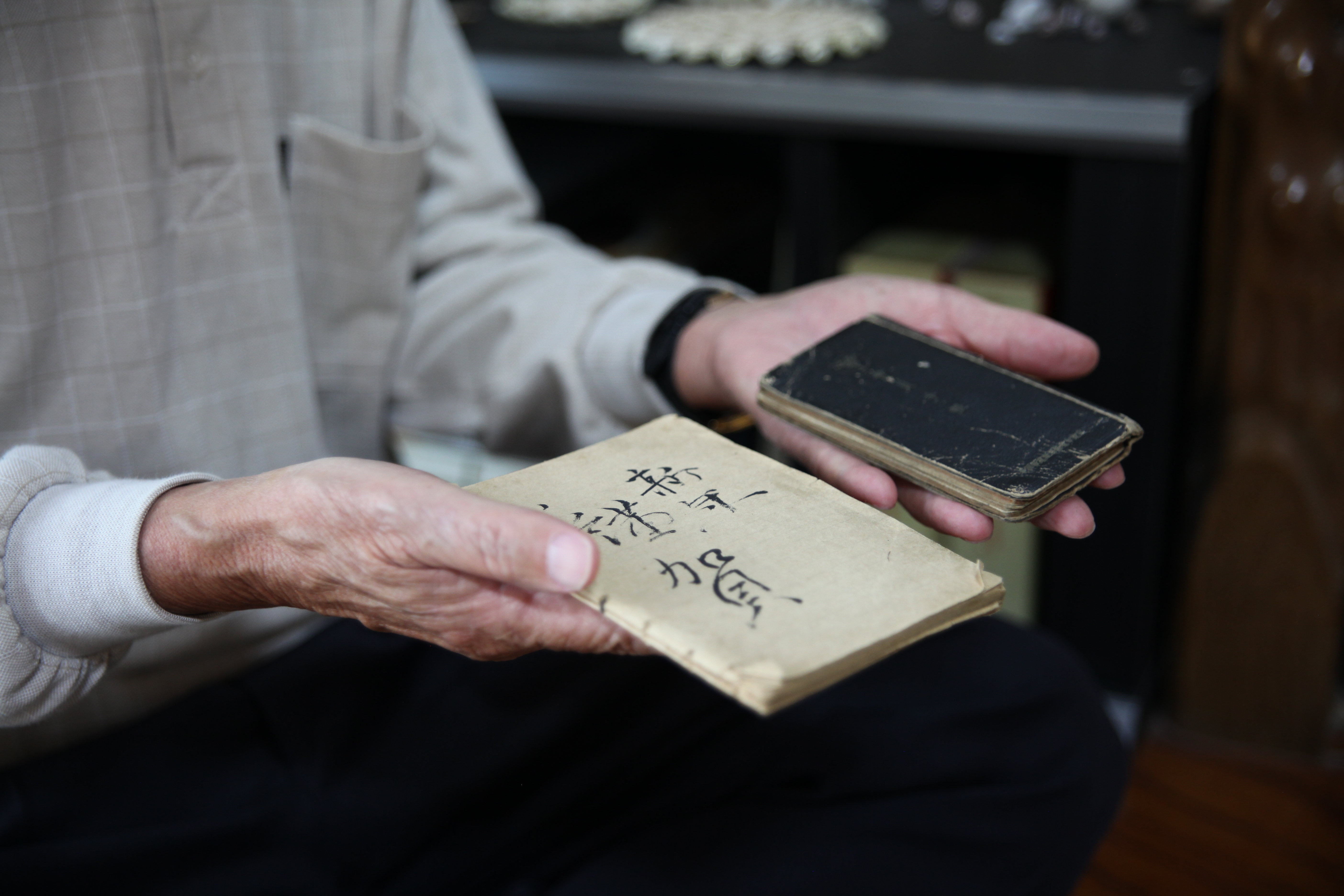 The two pocket notebooks in which Satō Tomigorō wrote his diary.